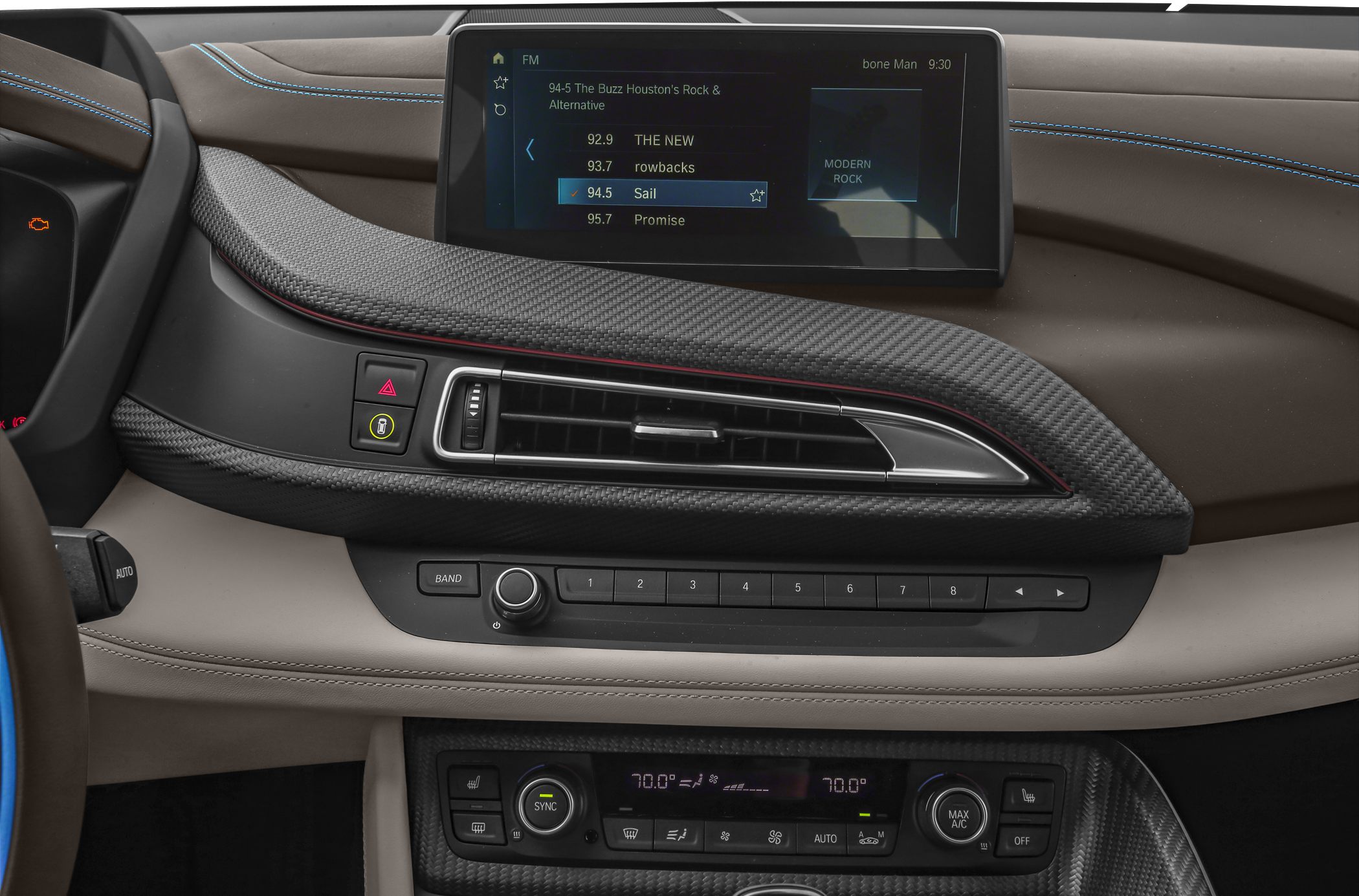 BMW dashboard with infotainment screen and carbon fiber trim