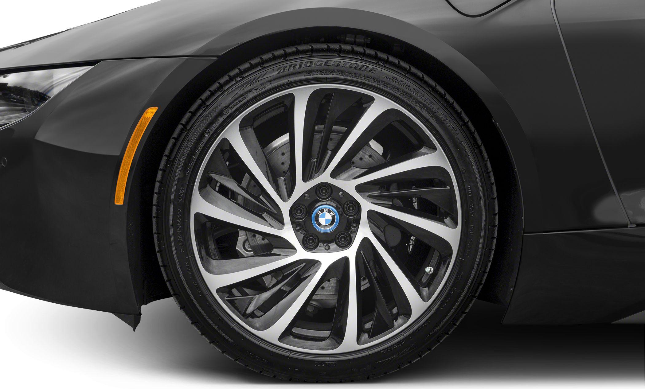 Close-up of BMW alloy wheel with Bridgestone tire and detailed brake components.