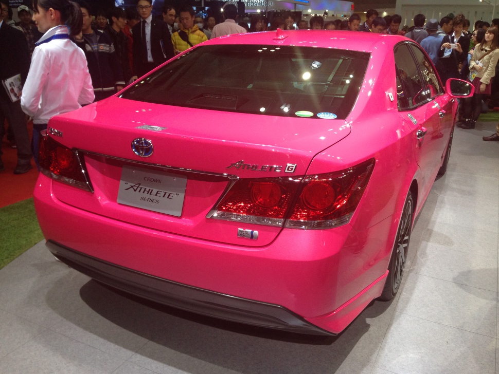 Bold pink sedan rear with sporty taillights and trim
