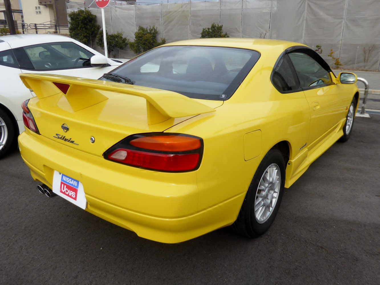 Rear view with large spoiler and distinctive taillights