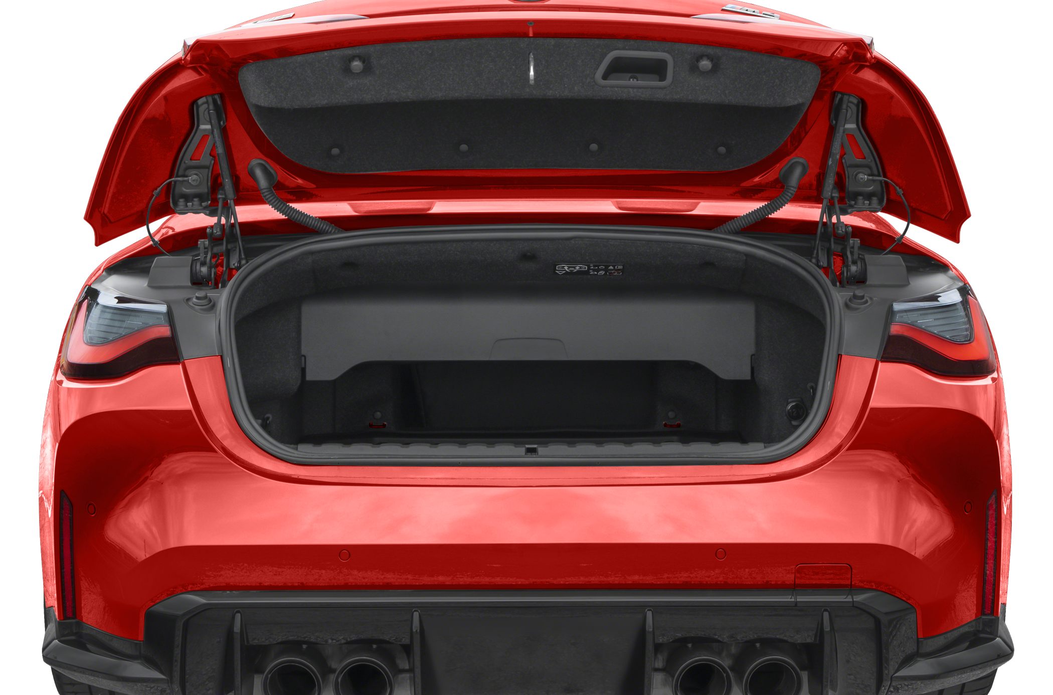 Open trunk with rear tail lights and quad exhausts in red vehicle
