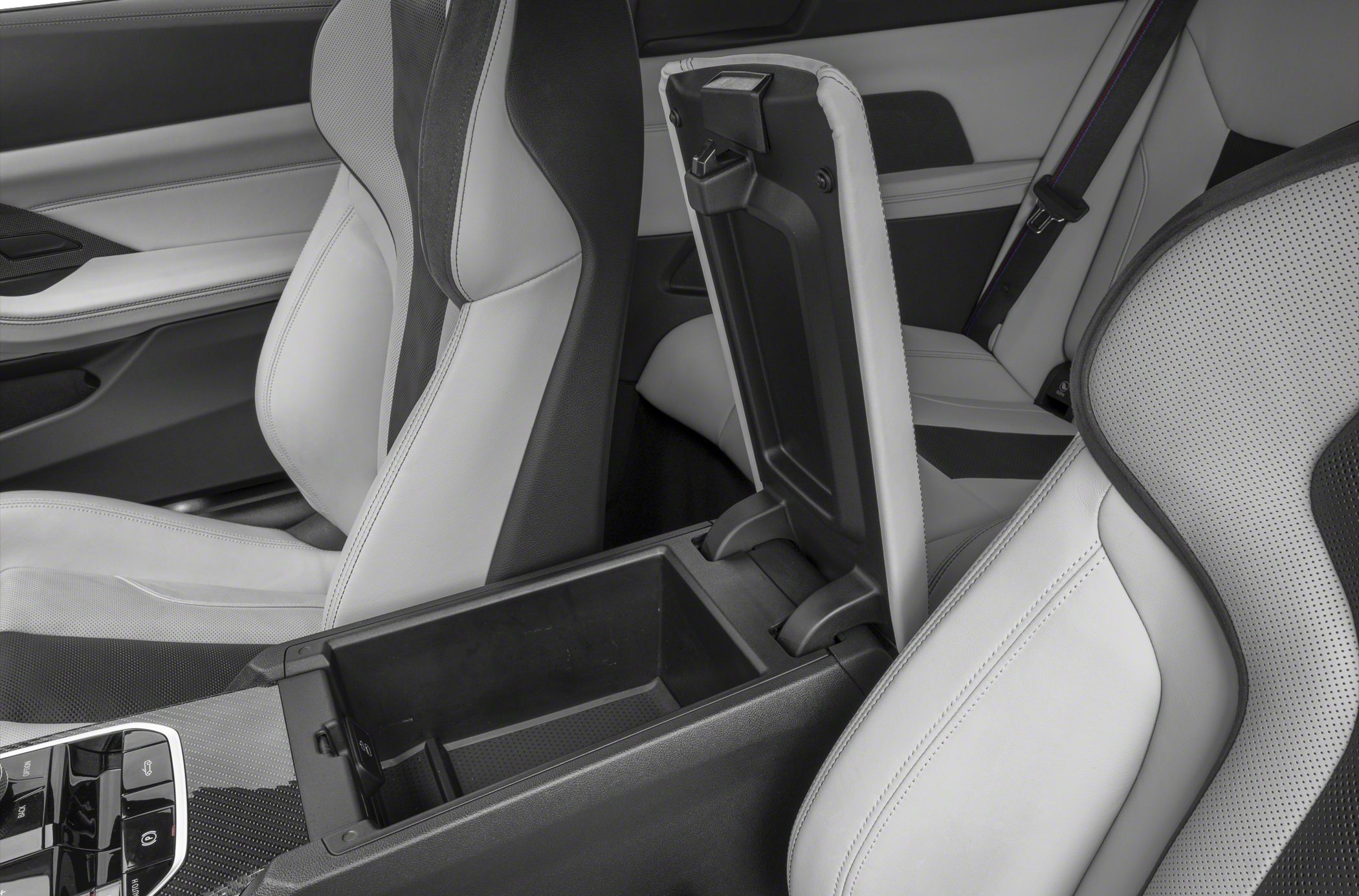 Center console storage compartment and detailed sport seats close-up