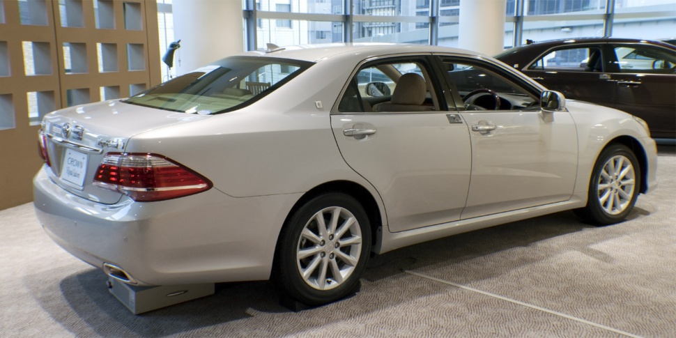 Rear and side view of sedan with alloy wheels and sleek body lines