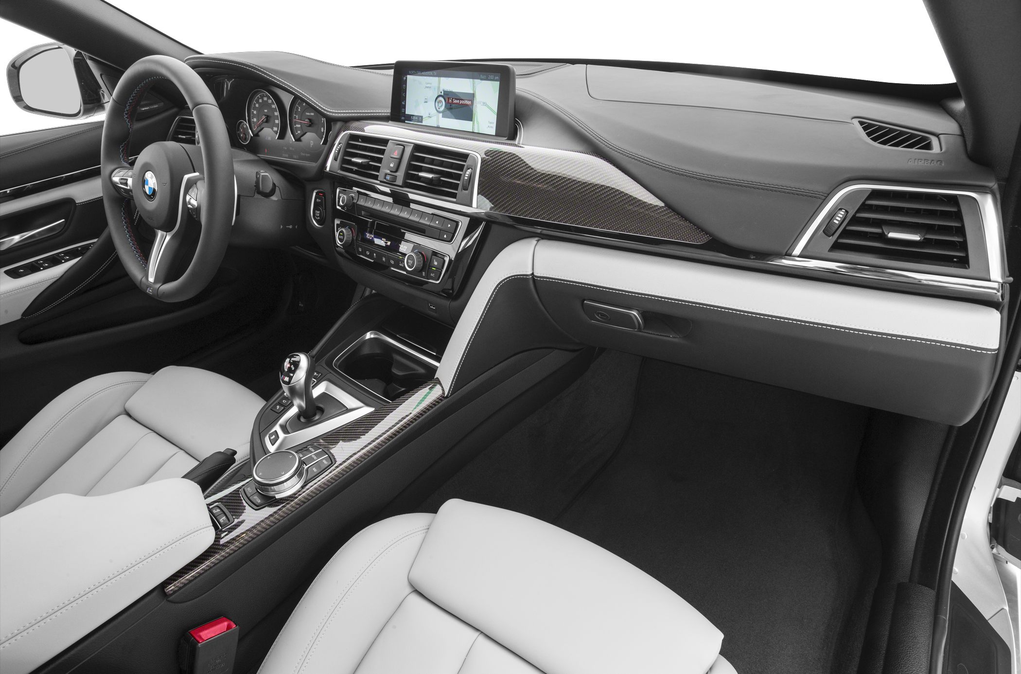 Interior with dashboard, carbon fiber trim, infotainment, and leather seats
