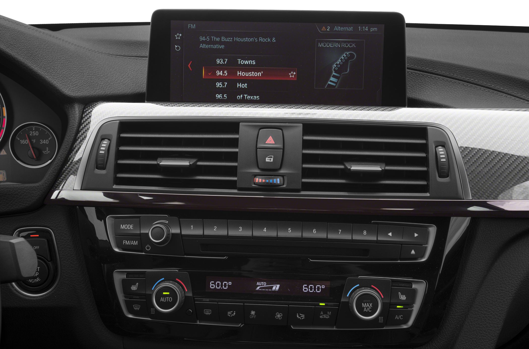 Infotainment screen, radio controls, dual-zone climate control in a car dashboard