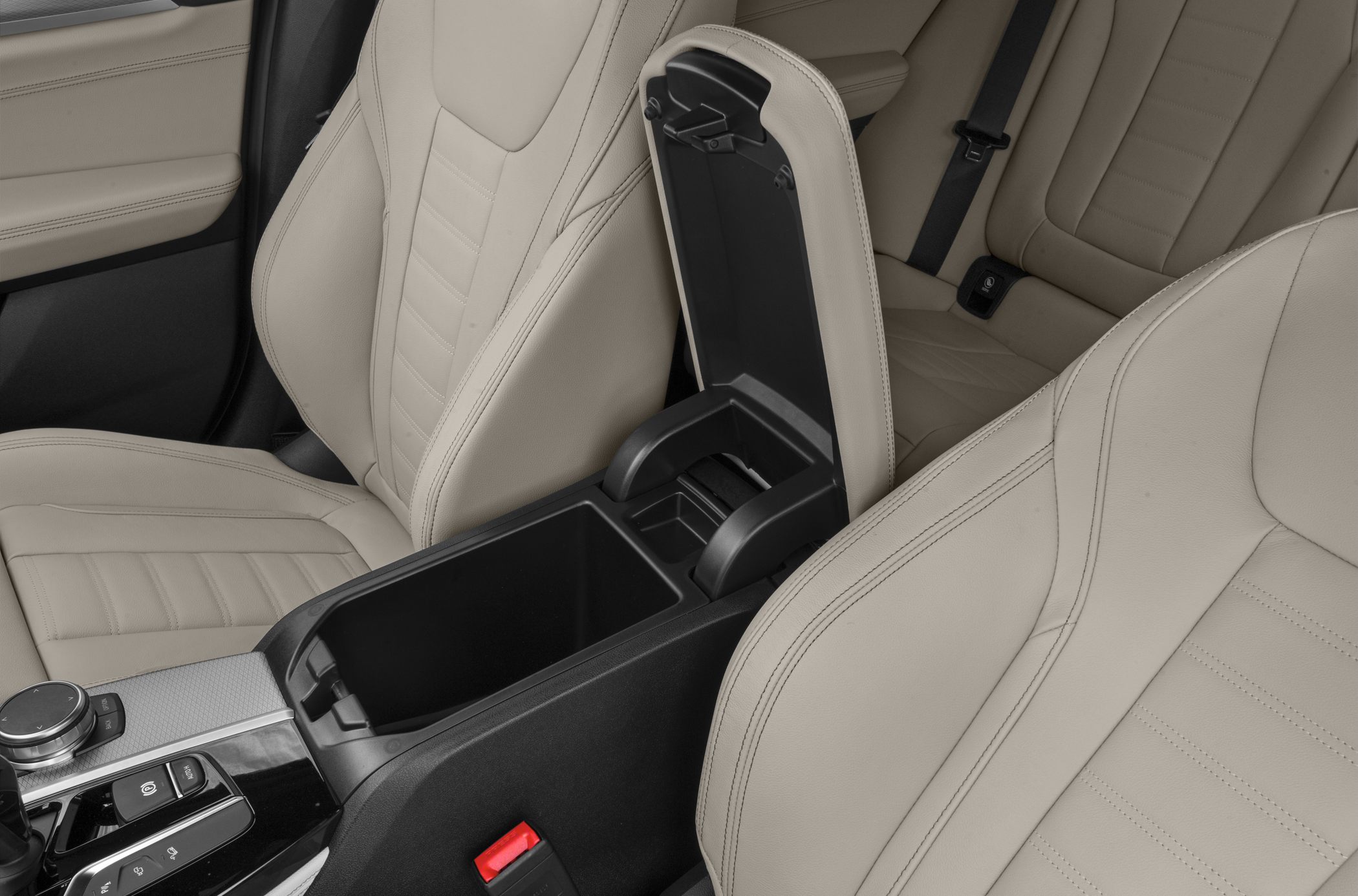 Center console storage compartment and beige leather seats