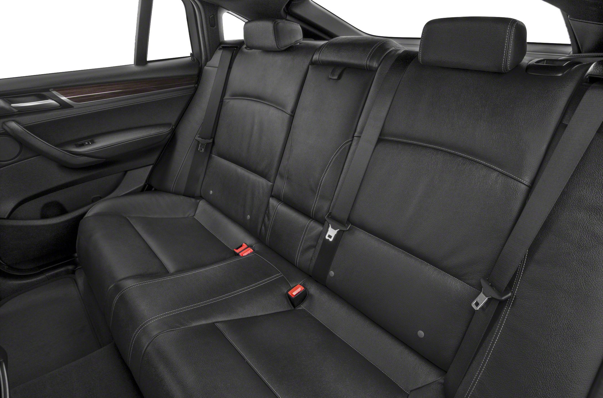 Black leather rear seat interior with integrated headrests and seatbelts