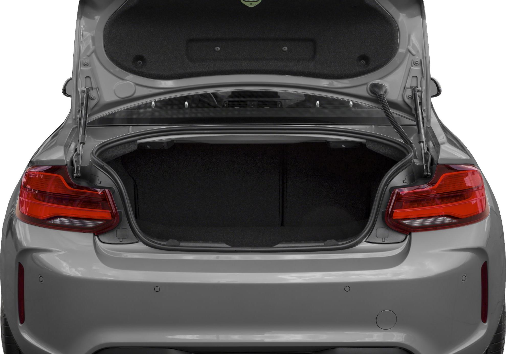 Open rear trunk and taillights of a coupe