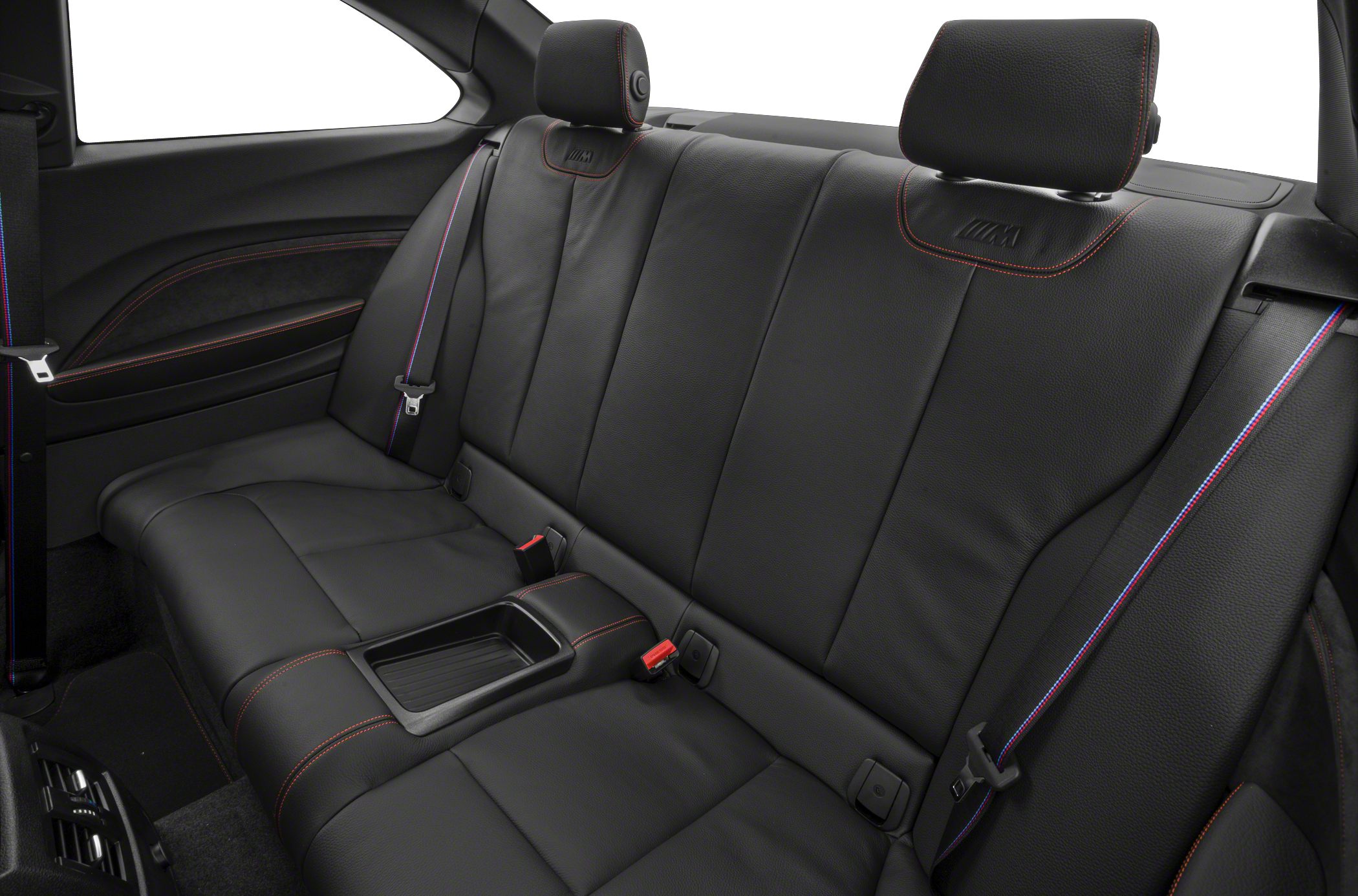 Rear black leather seats with red stitching and M series sport seat belts.