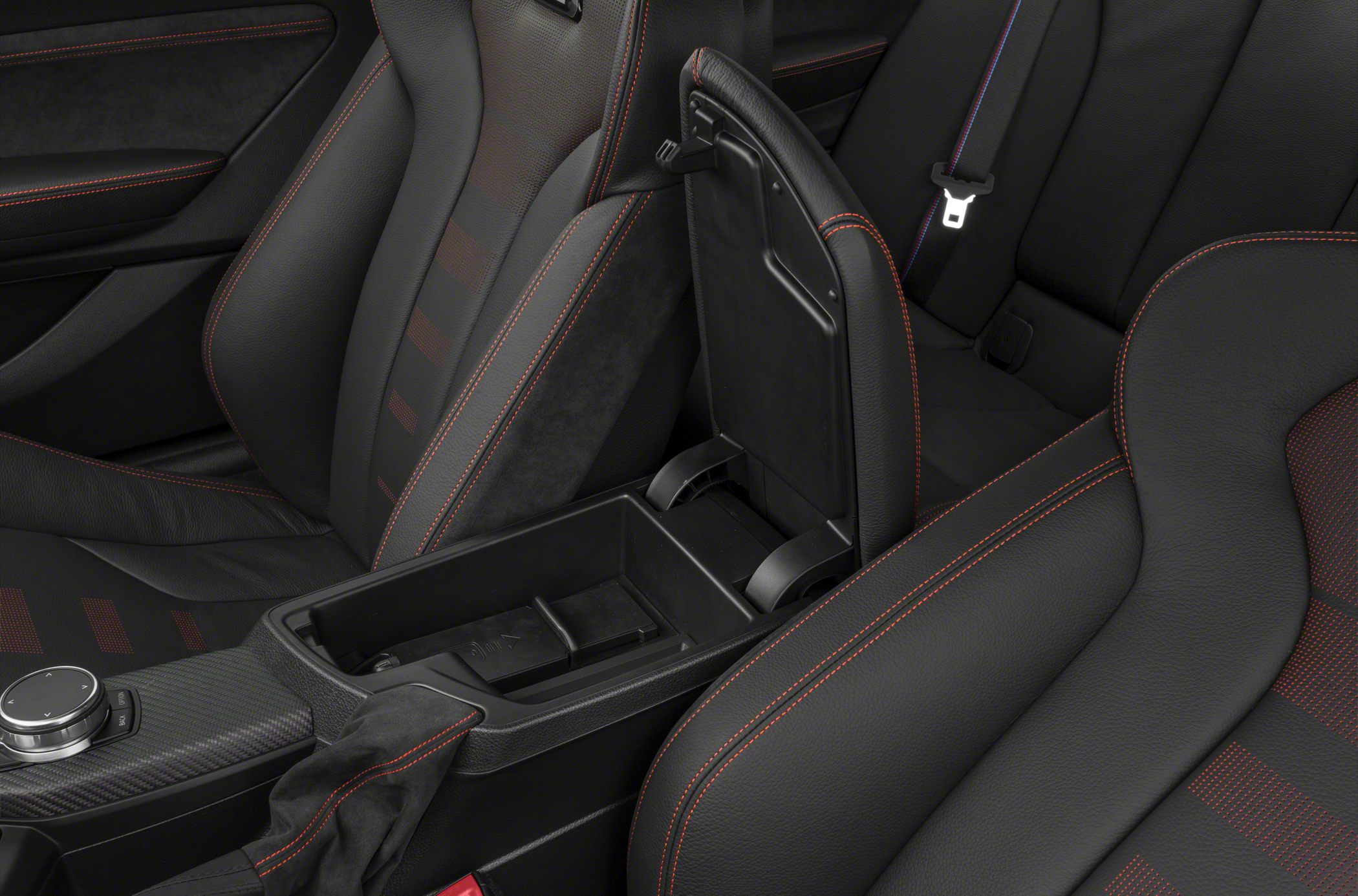Open center console storage and black sport seats with red stitching