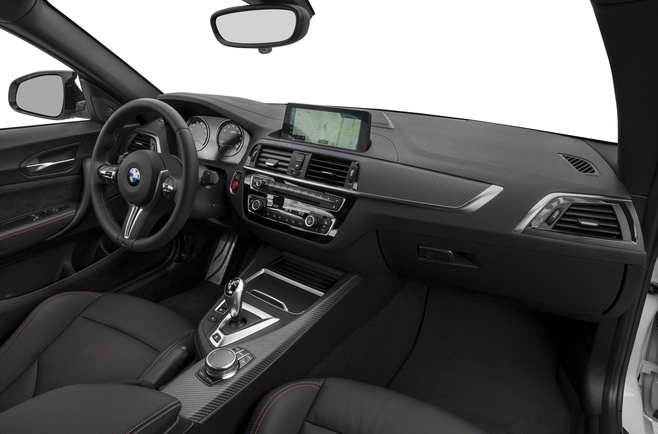 Sporty steering wheel and carbon fiber accented dashboard with digital display.
