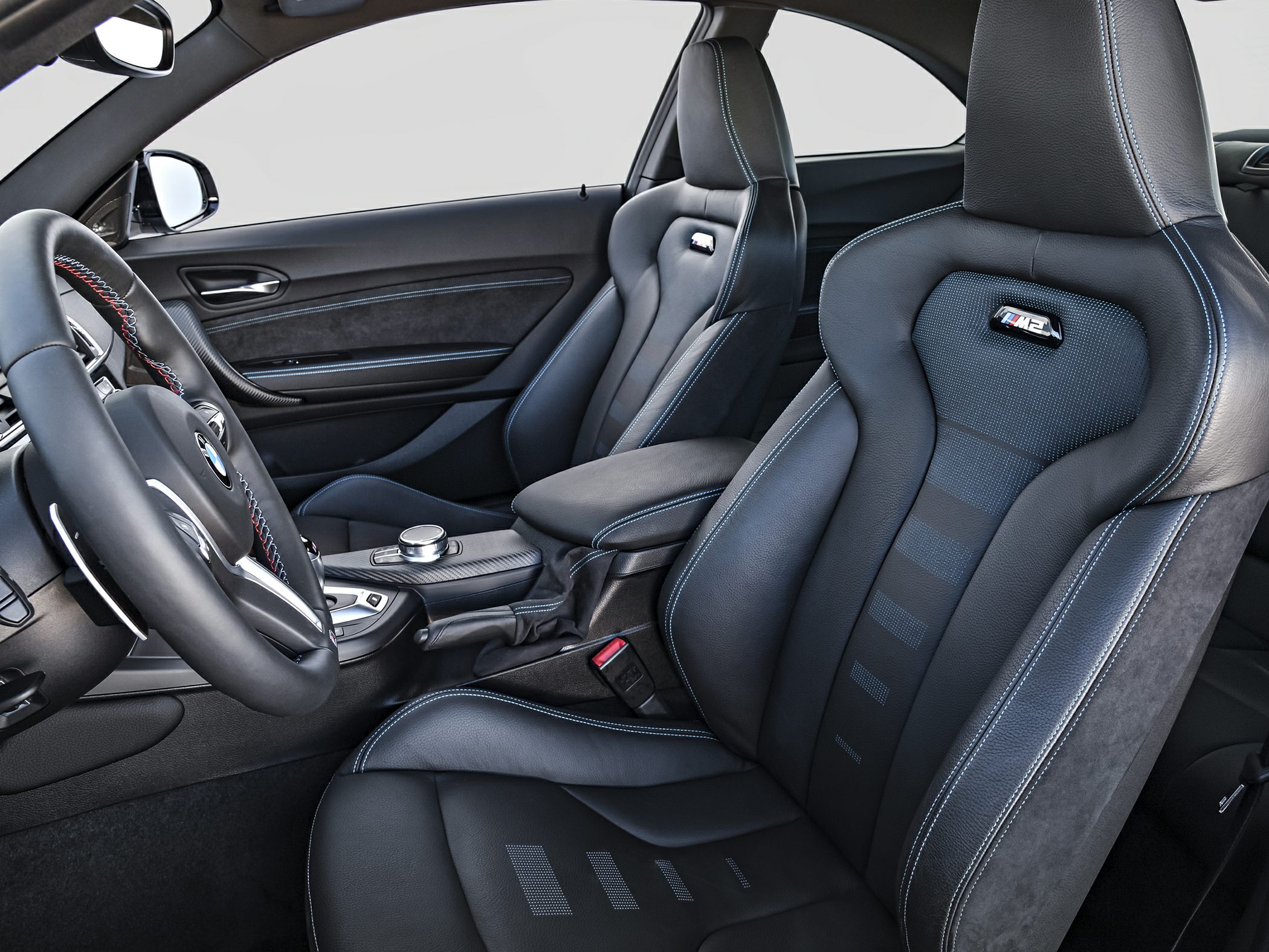Sport seats and leather steering wheel with blue stitching