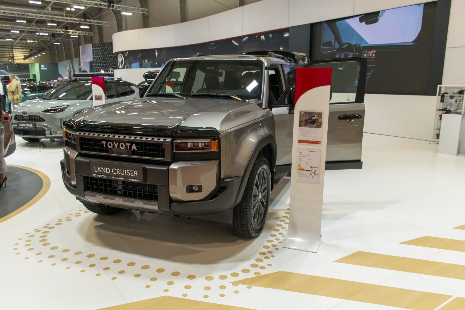Bold front grille and open driver-side door of a 2024 SUV