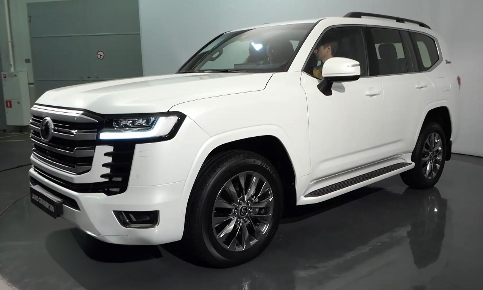 White luxury SUV with LED headlights and chrome grille