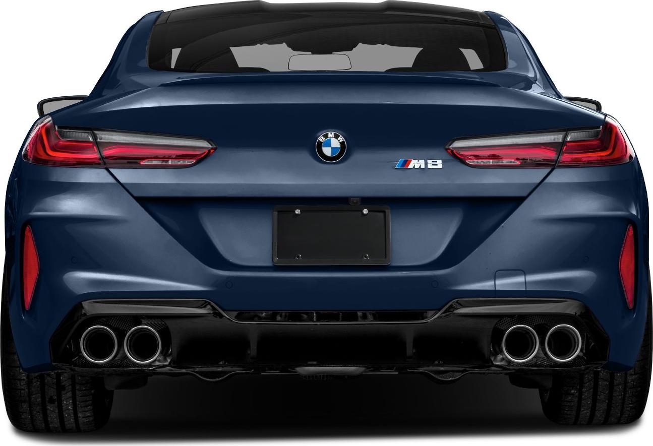 Rear view of a sporty coupe with quad exhaust tips