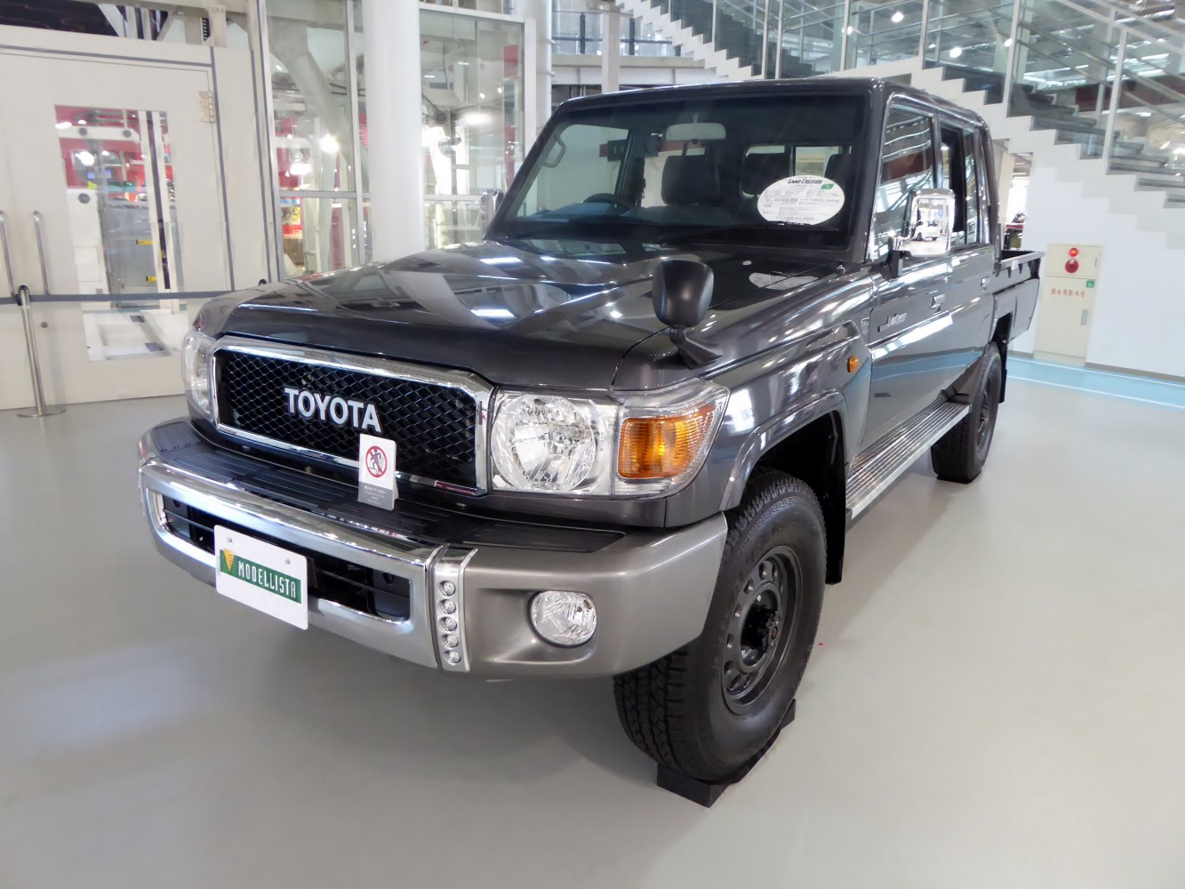 Front angled view of rugged pickup truck with robust grill and headlights