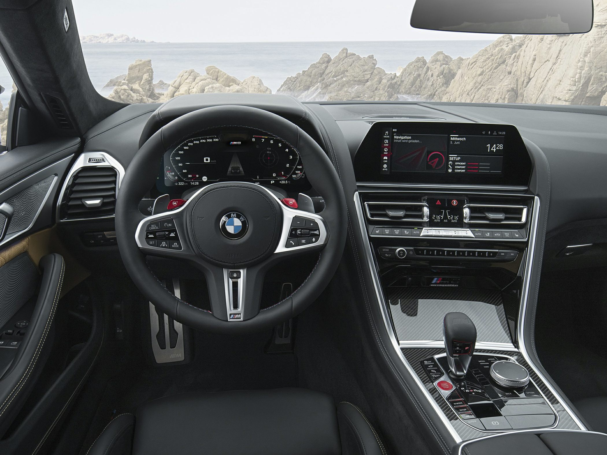Digital dashboard and advanced center console with steering wheel controls.