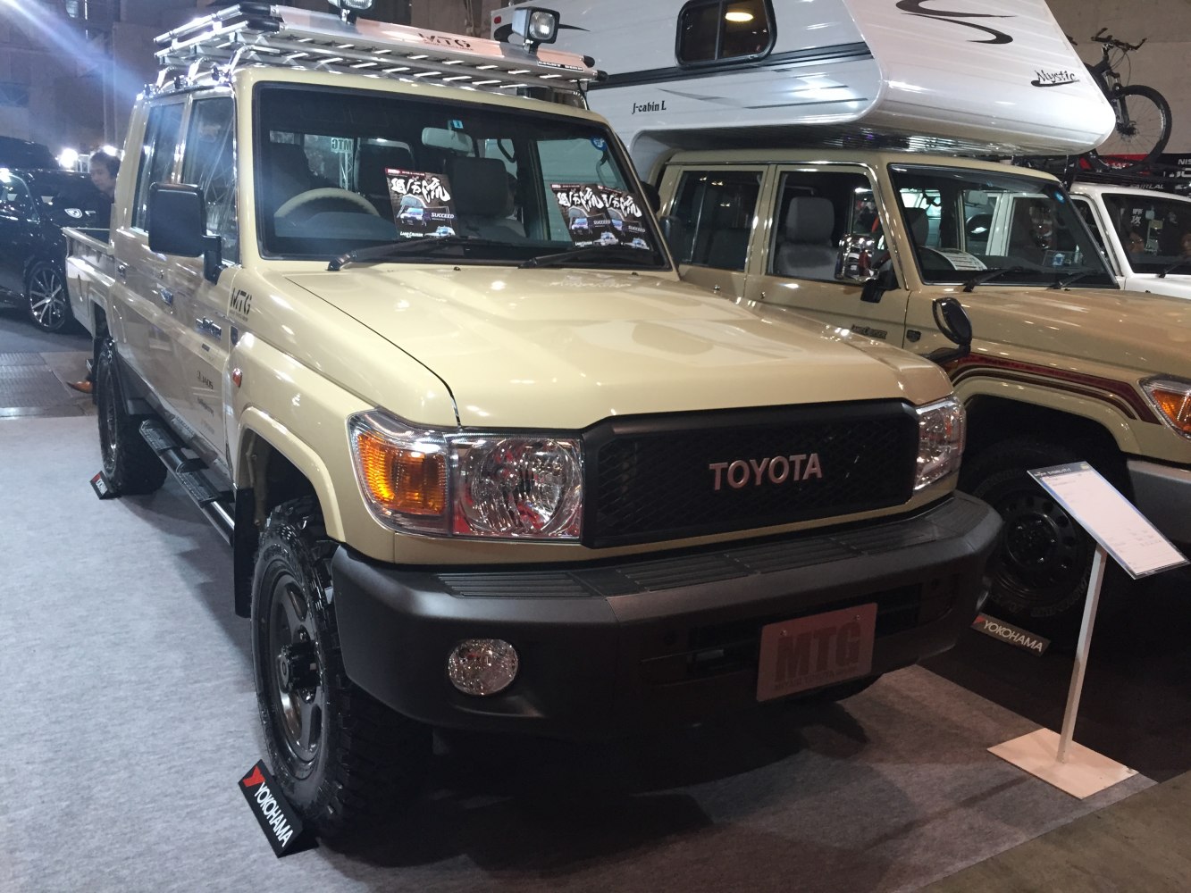 Double cab pickup with roof rack and rugged tires