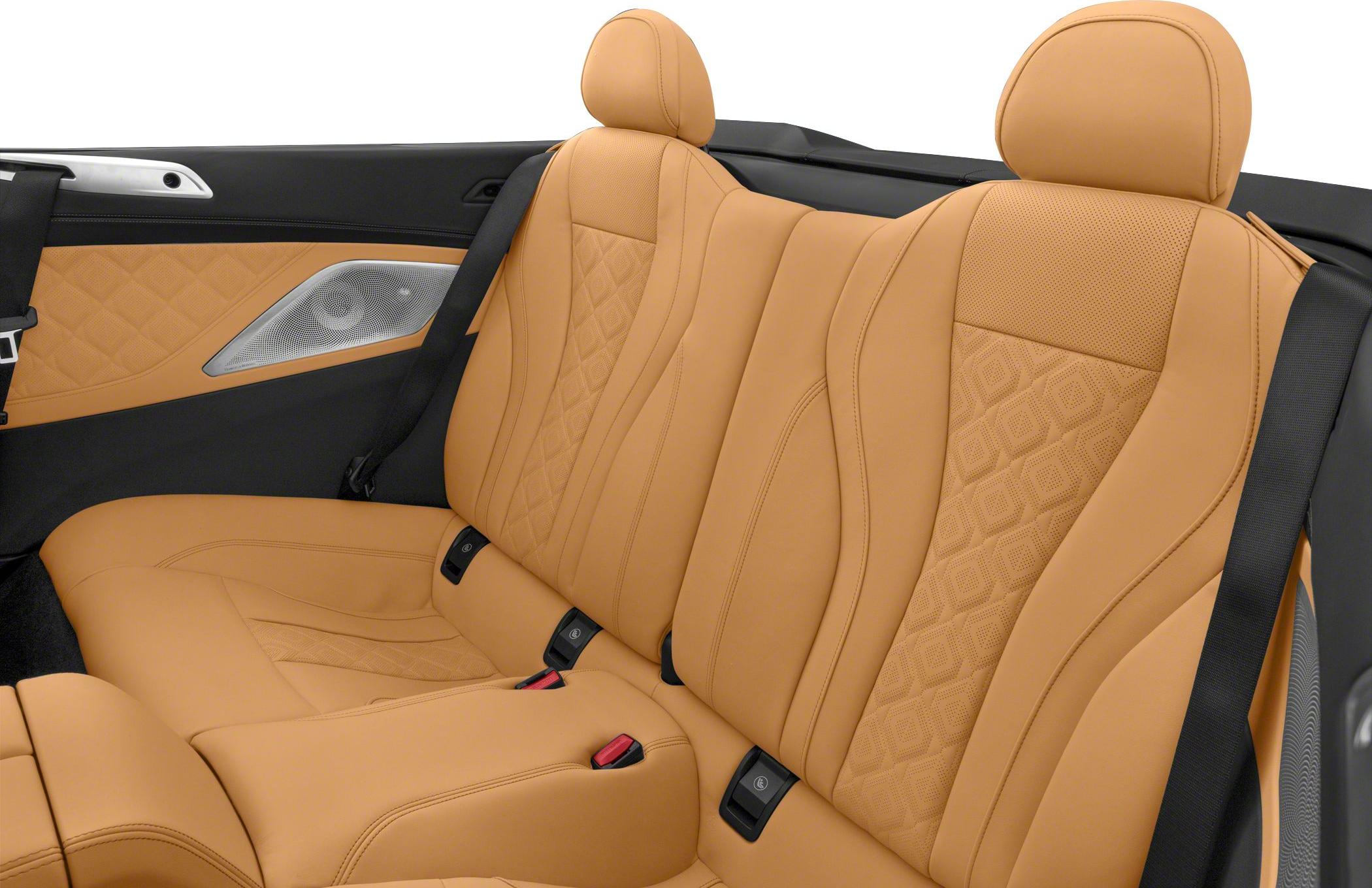 Beige quilted leather rear seats with headrests and seatbelts