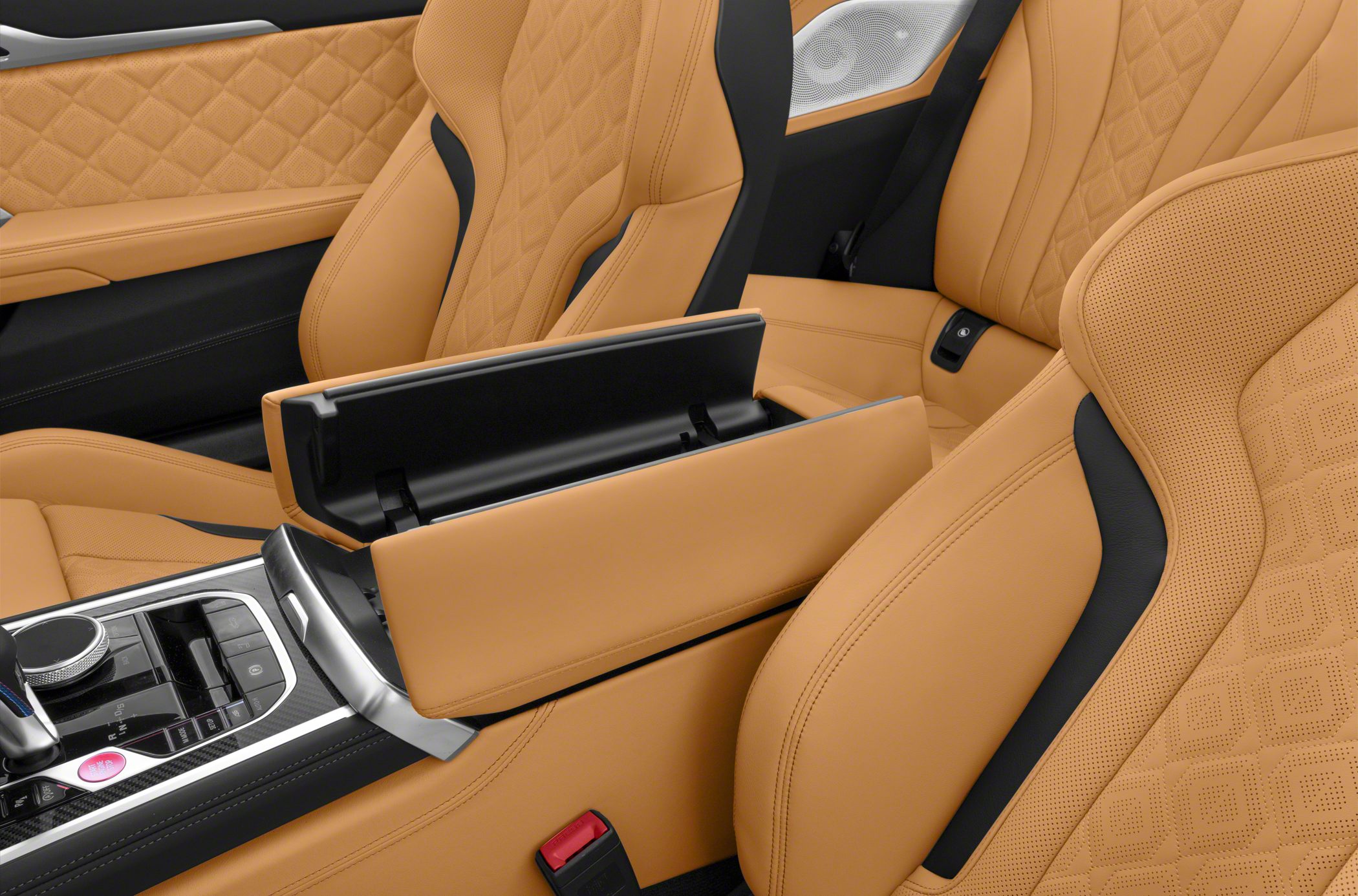 Premium tan leather seats with detailed quilting and open central armrest