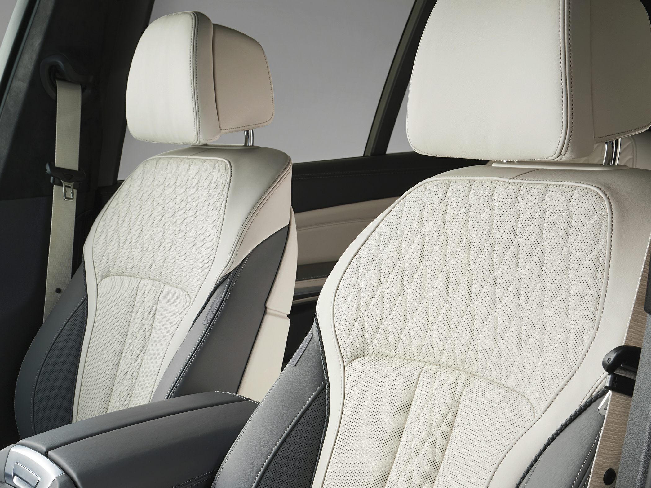 Two-tone leather front seats with quilted pattern and headrests