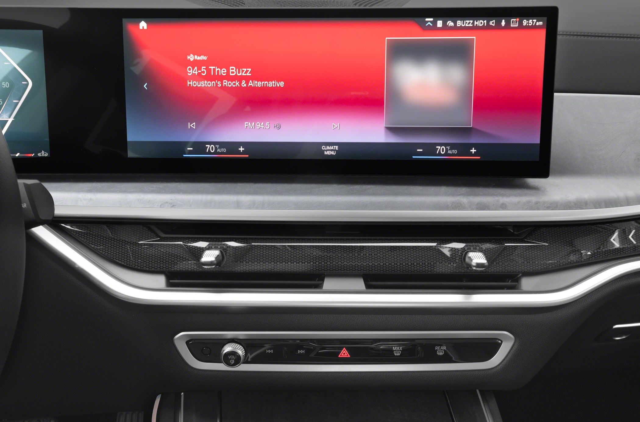 Digital infotainment display and dual-zone climate controls with volume knob