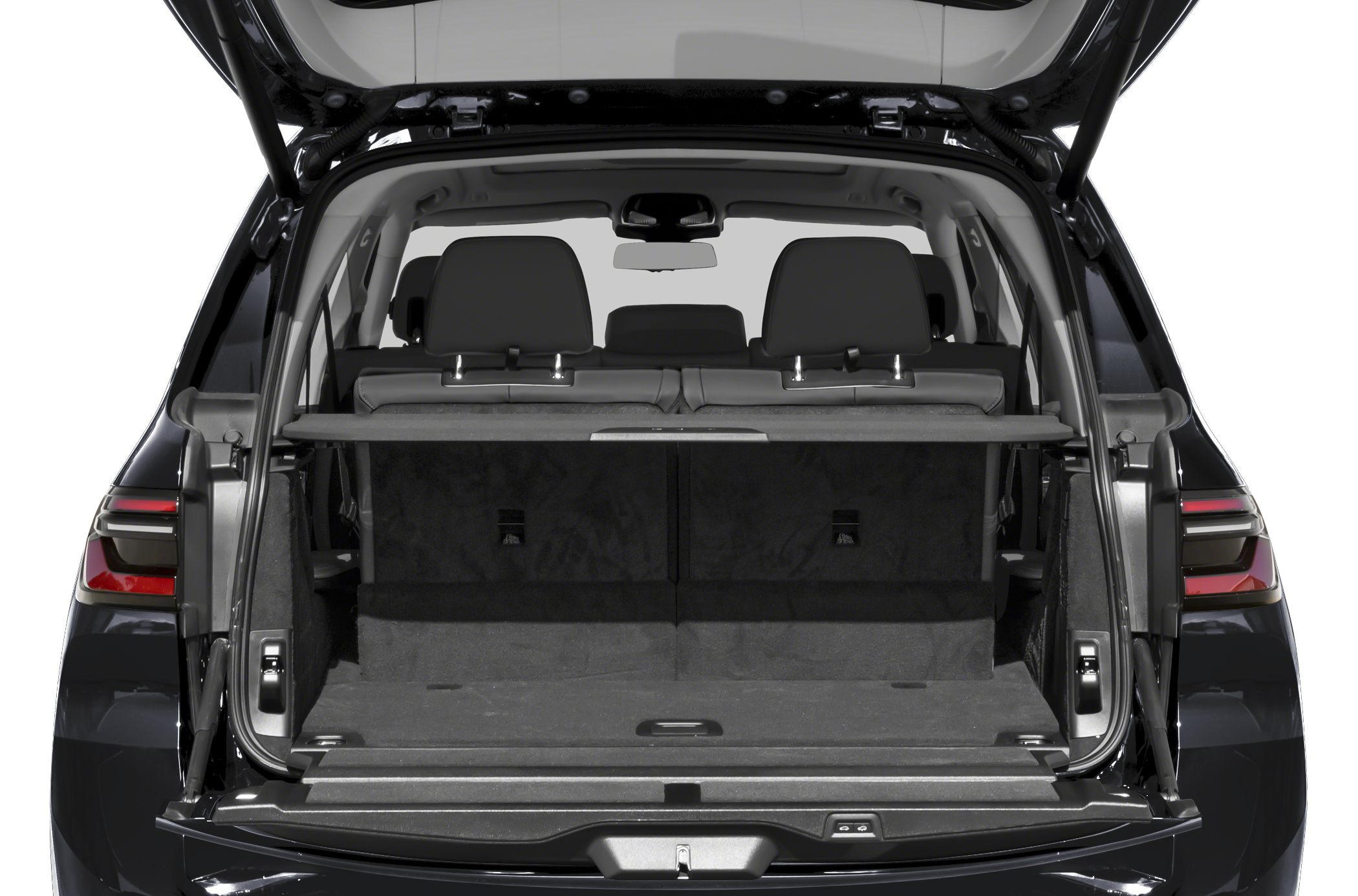SUV cargo area with rear seats and open tailgate
