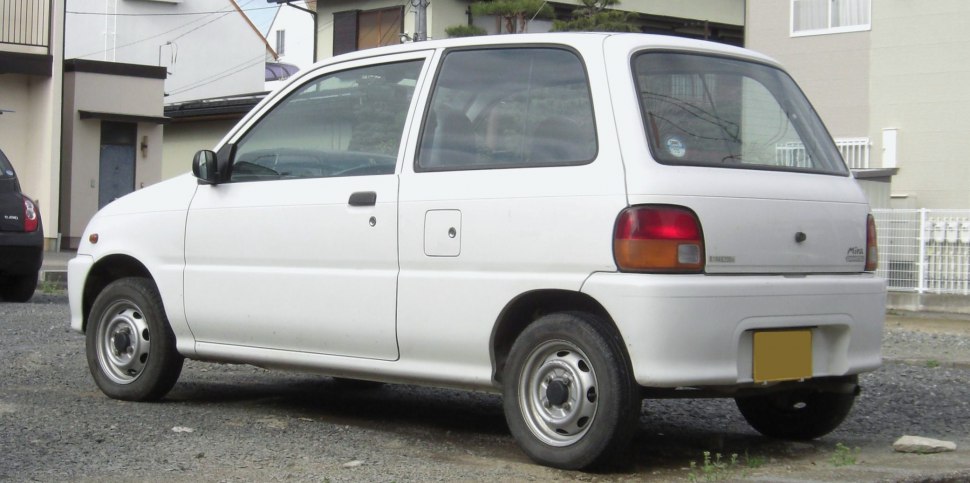 Compact hatchback showing rear and side profile with steel wheels