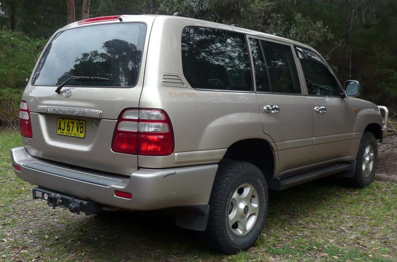 Rear and side view of SUV with large taillights and alloy wheels