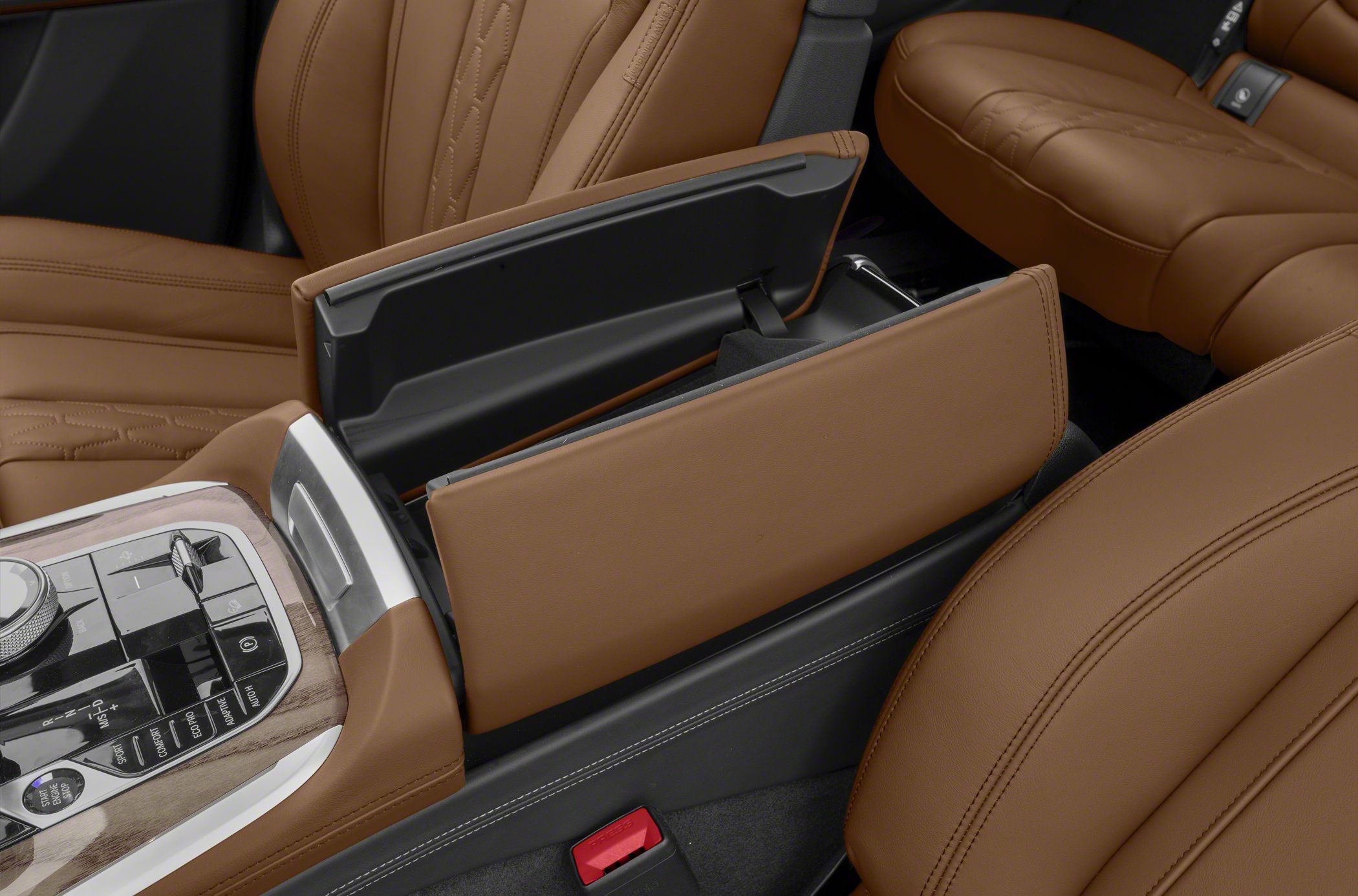 Brown leather seats and center console with control panel and storage compartment