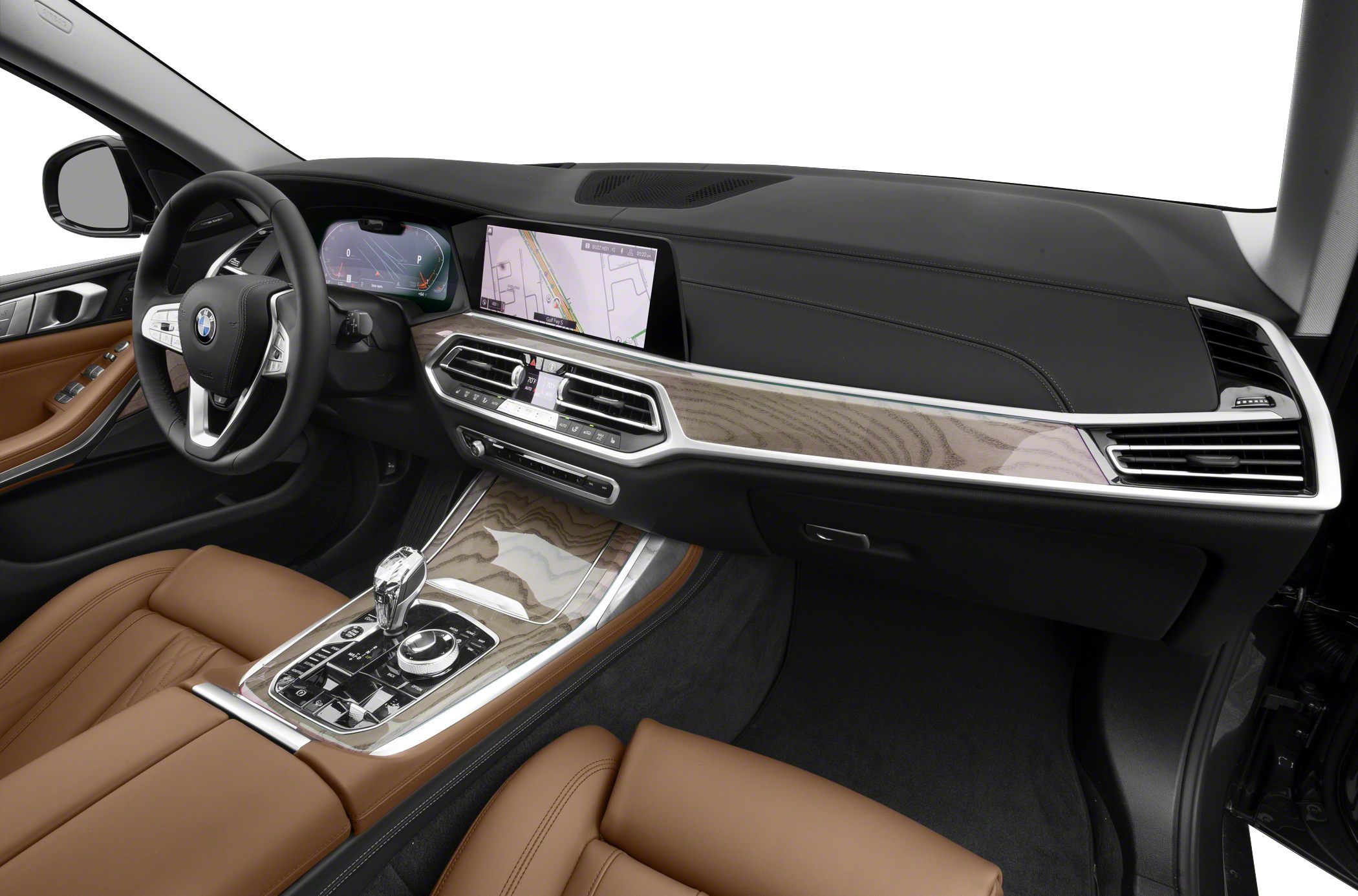 Wood trim dashboard with digital displays and brown leather seats.