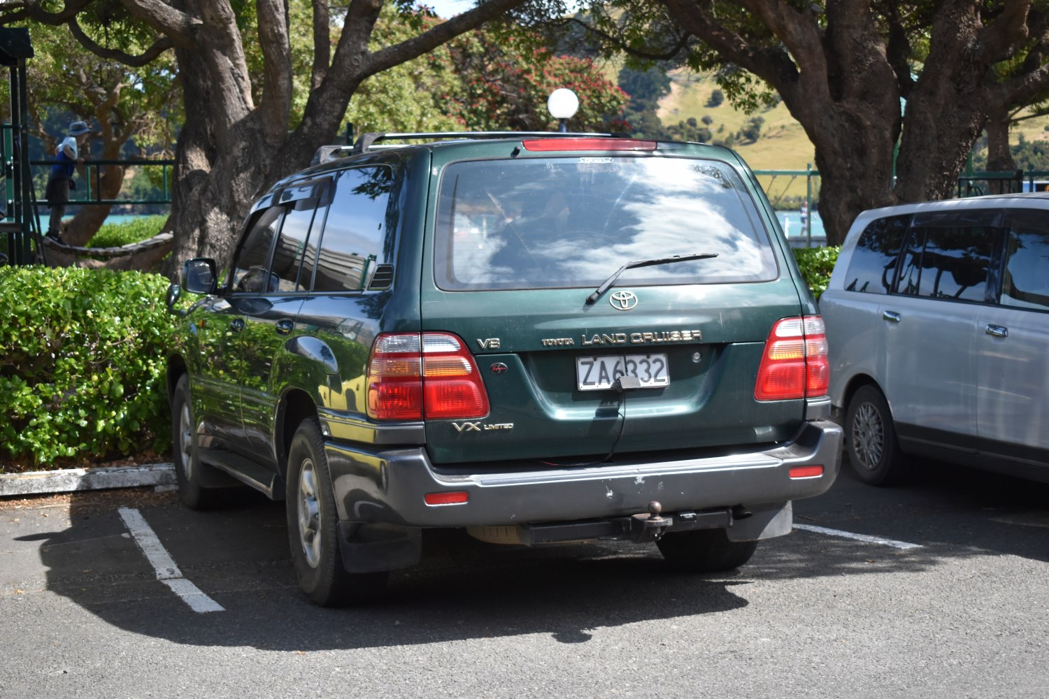 Rear view of an SUV with V8 and VX Limited badges in a parking lot