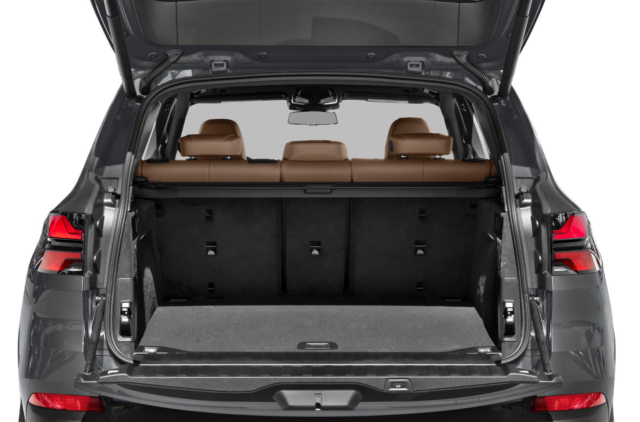 Open spacious cargo area with brown leather rear seats