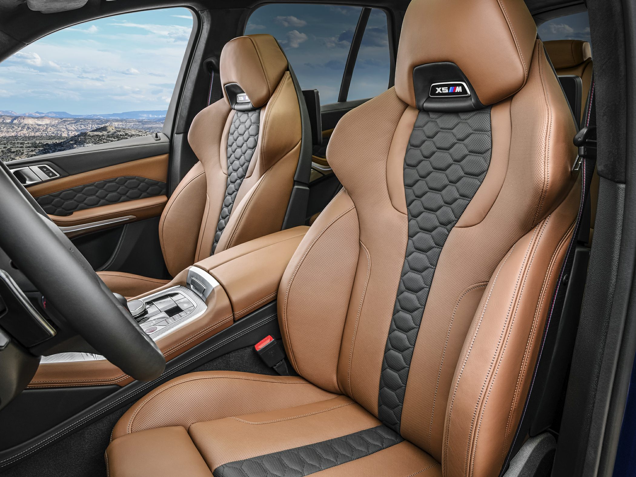 Luxury brown and black leather seats with hexagonal pattern details