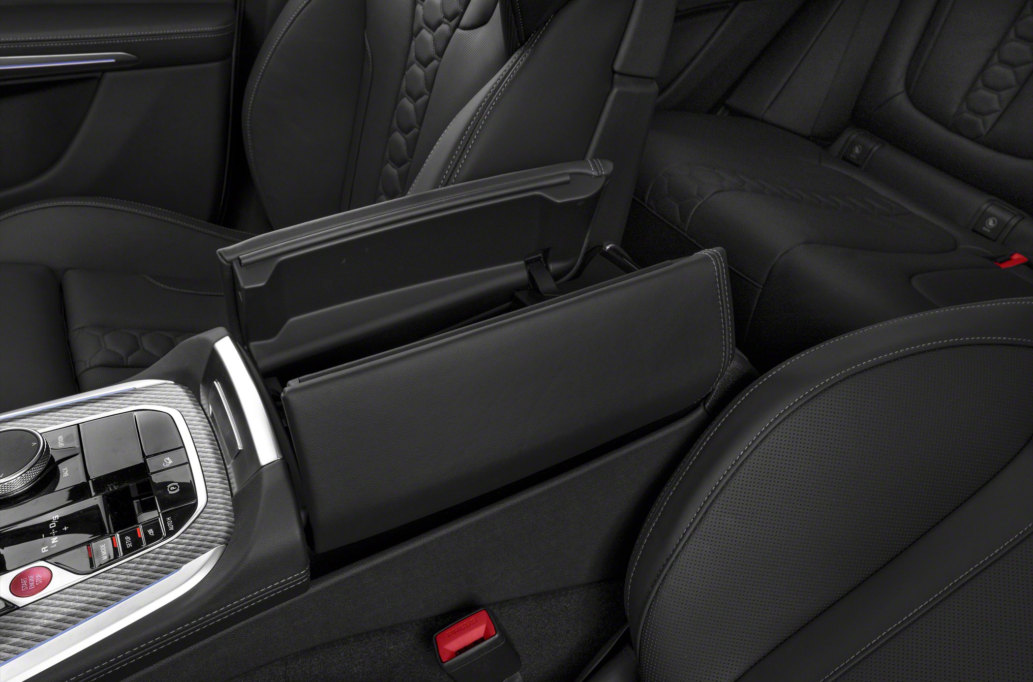 Premium black leather interior with detailed stitching and open center console storage.