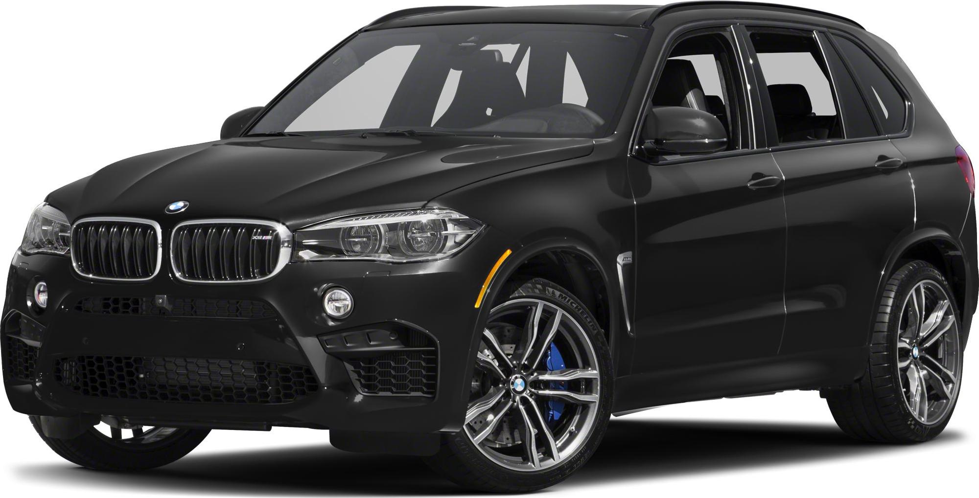 Front side view of black BMW SUV with grille and alloy wheels