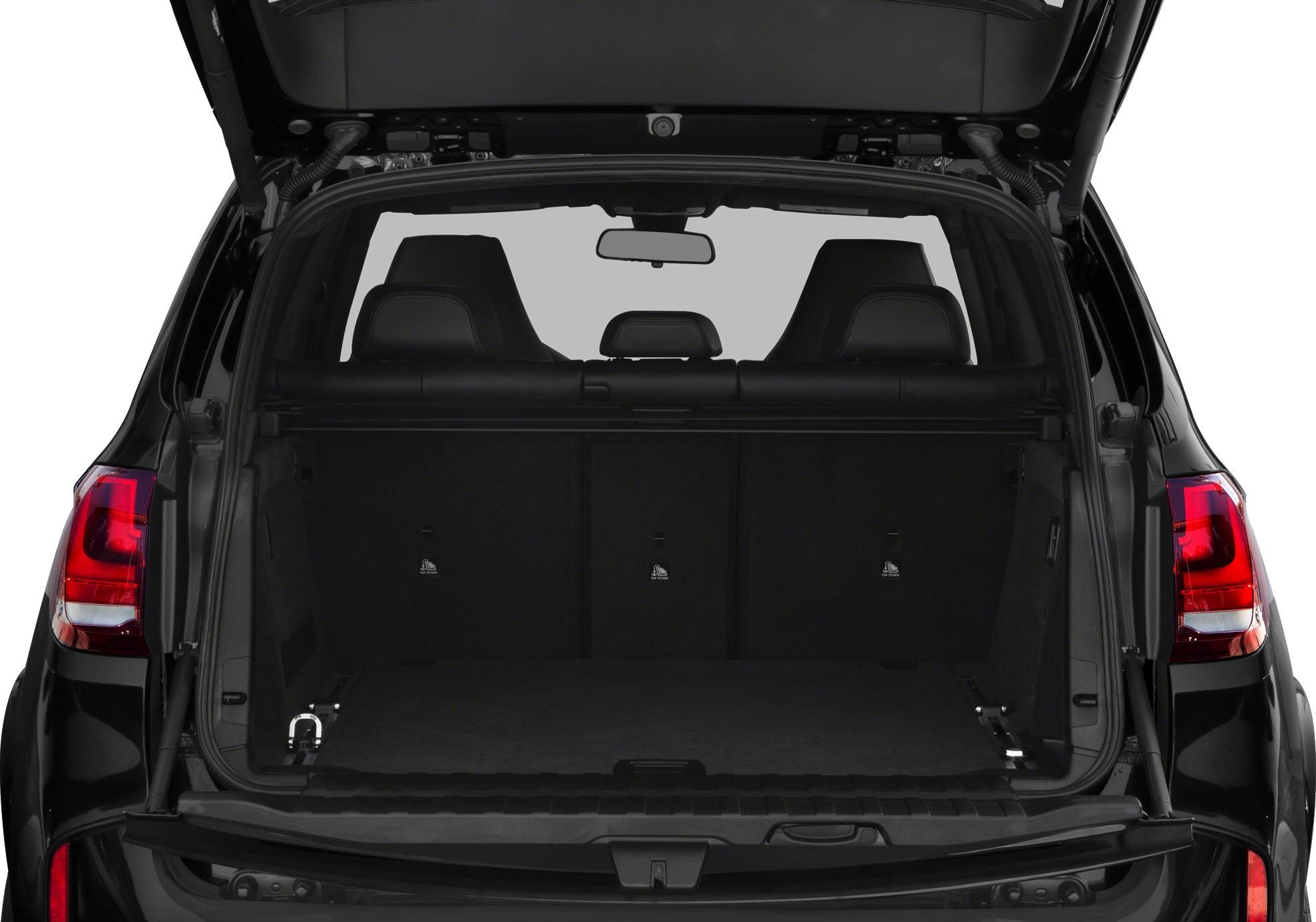 Open rear trunk interior with visible rear seats and spacious cargo area