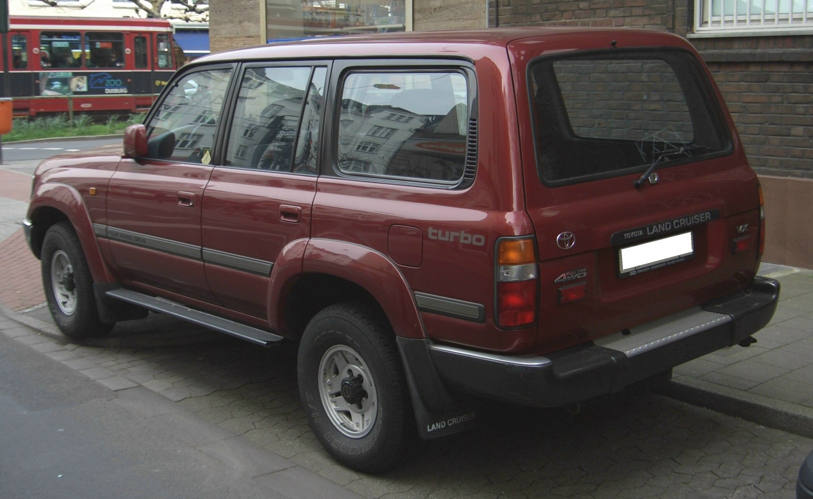 Rear and side view of a rugged turbo SUV with full-time 4WD and distinct large rear window.
