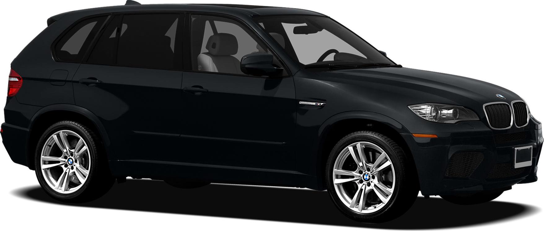 Side profile of a black SUV with alloy wheels in studio lighting.