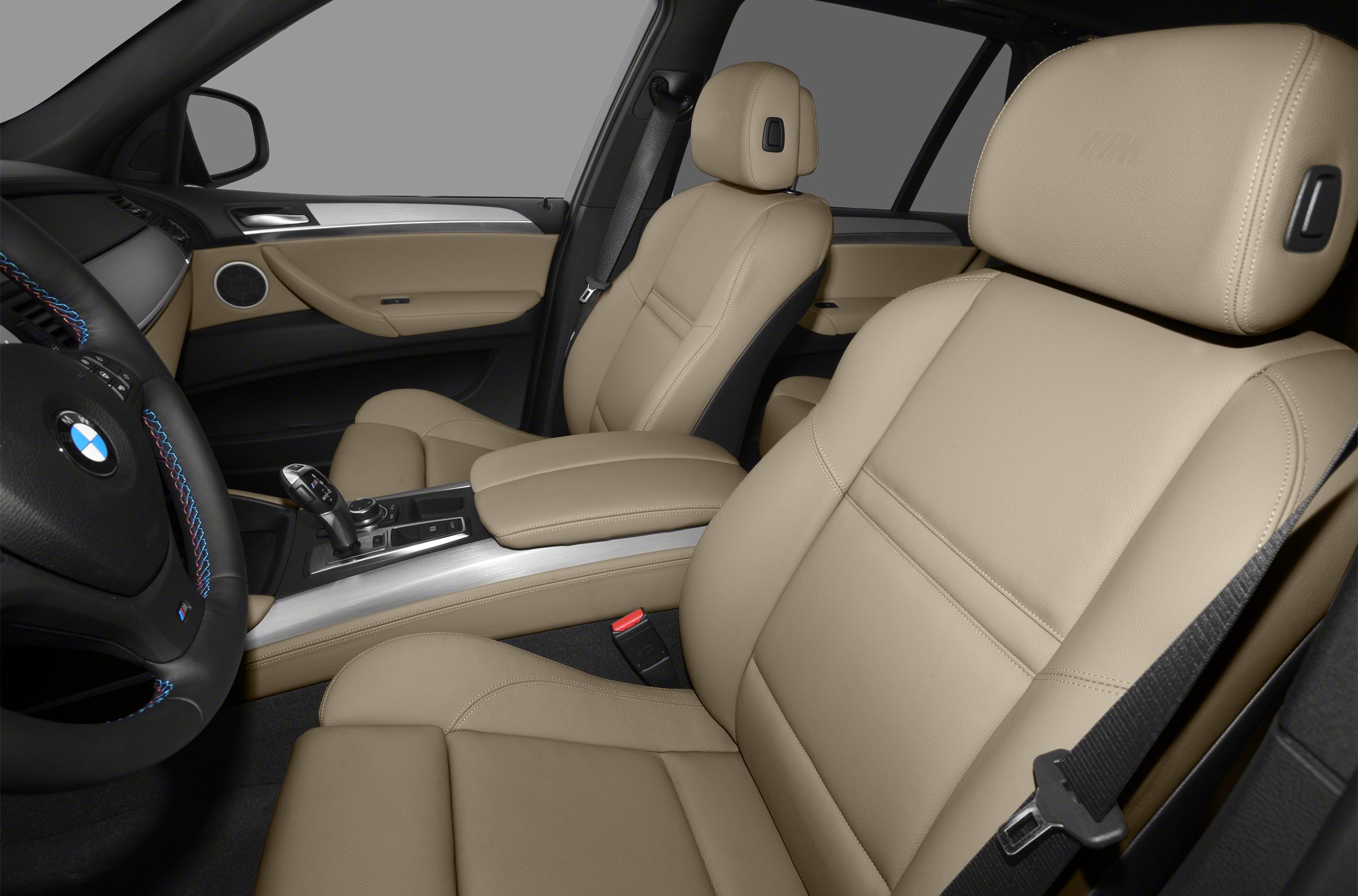 Beige leather seats and steering wheel with BMW logo