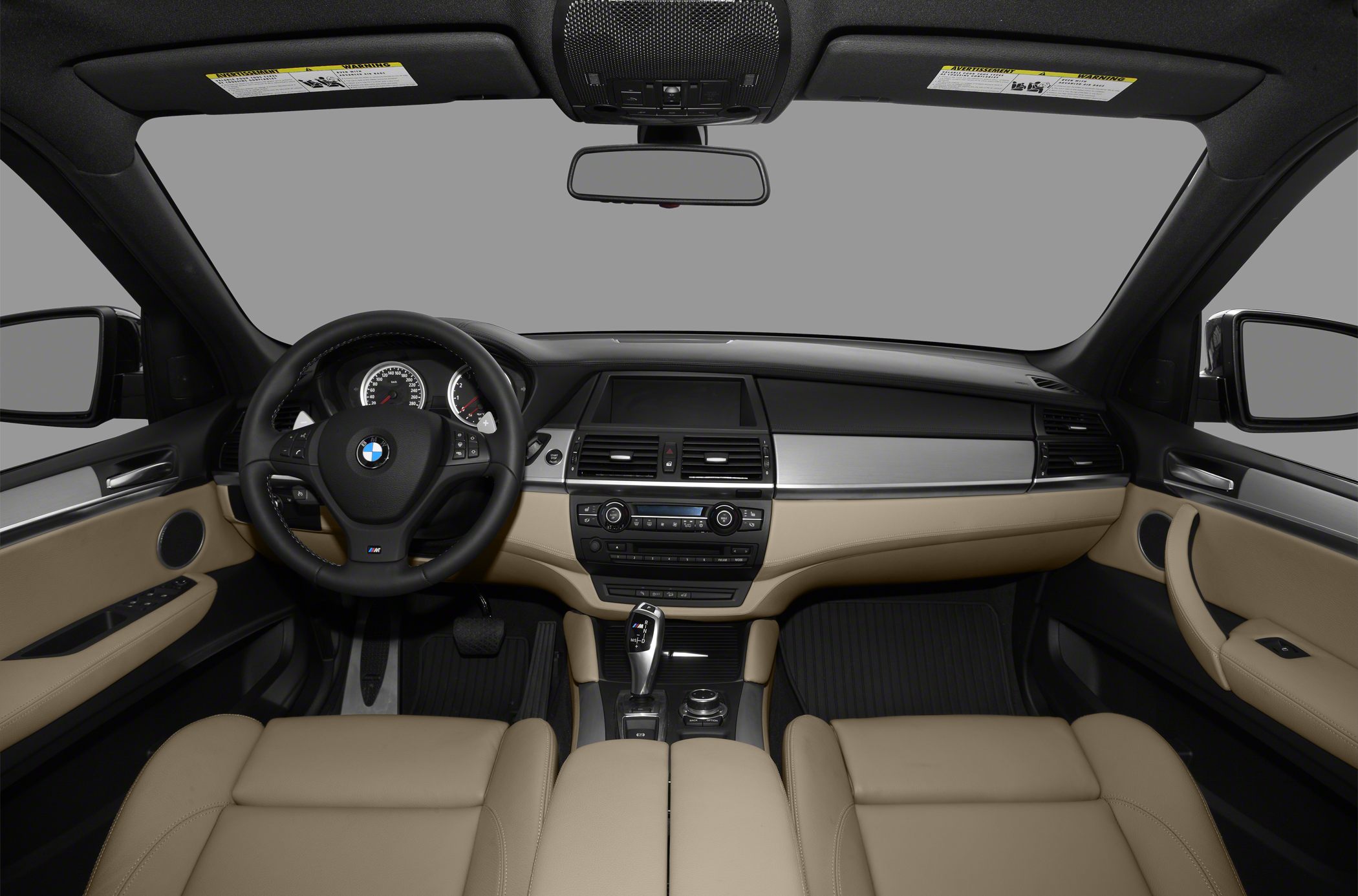 Luxury SUV interior with beige leather and modern dashboard