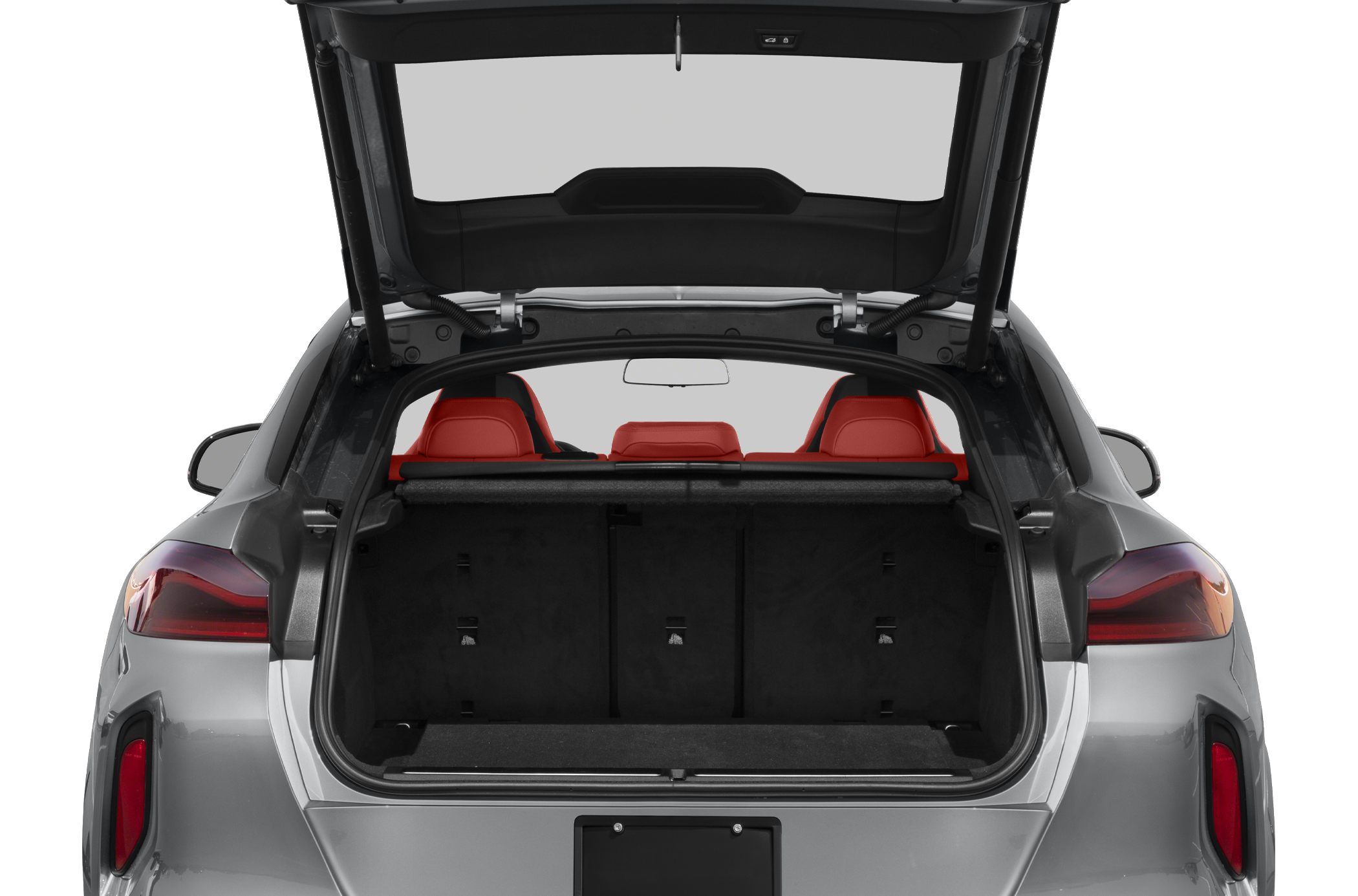 Open trunk with spacious cargo area and red rear seats