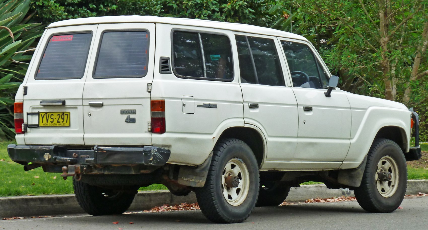 Rear and side view of rugged SUV with off-road tires