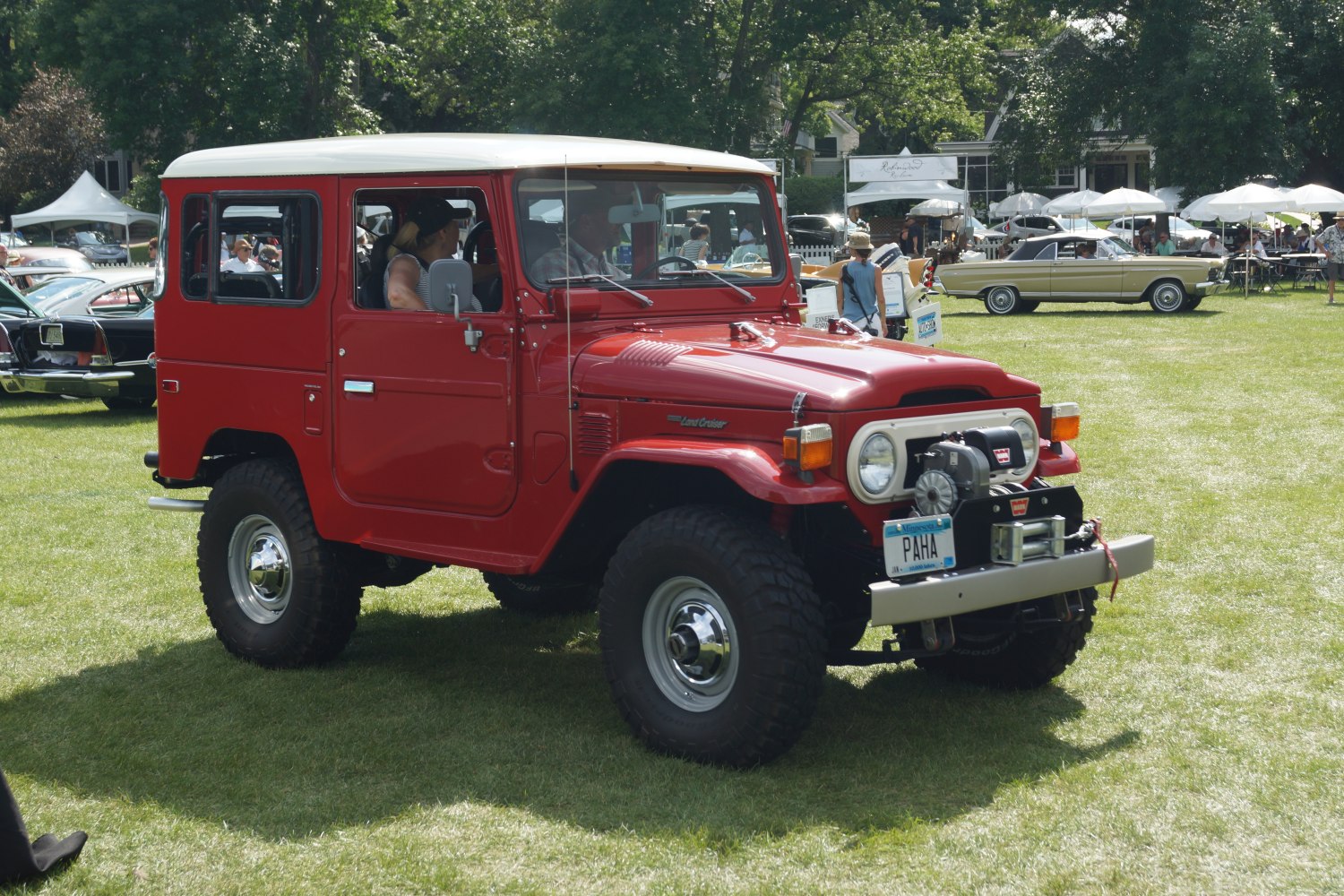 Red SUV with winch front bumper and hard top roof