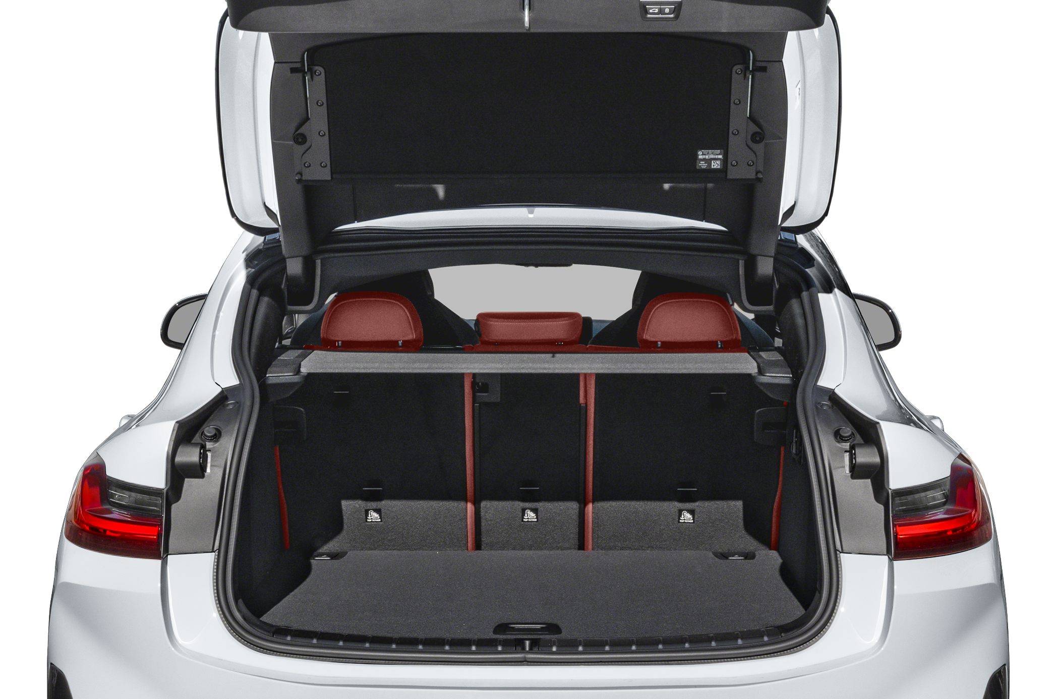 Spacious rear cargo area with red rear seats and foldable backrests