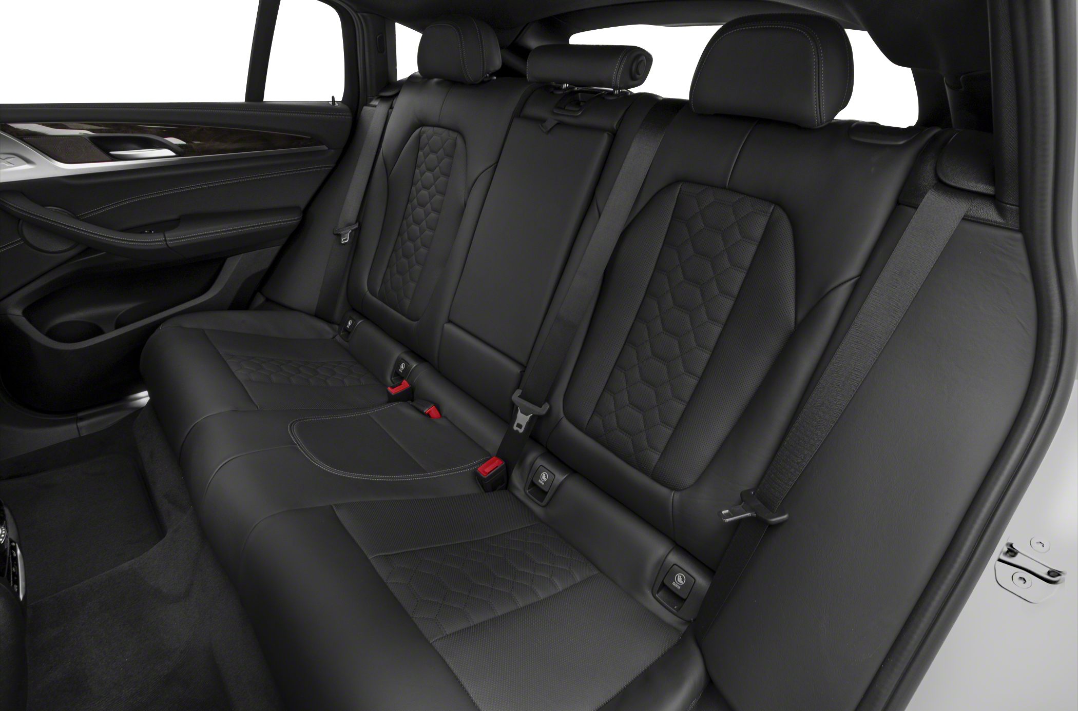 Rear black leather seats with quilted pattern and seatbelts.