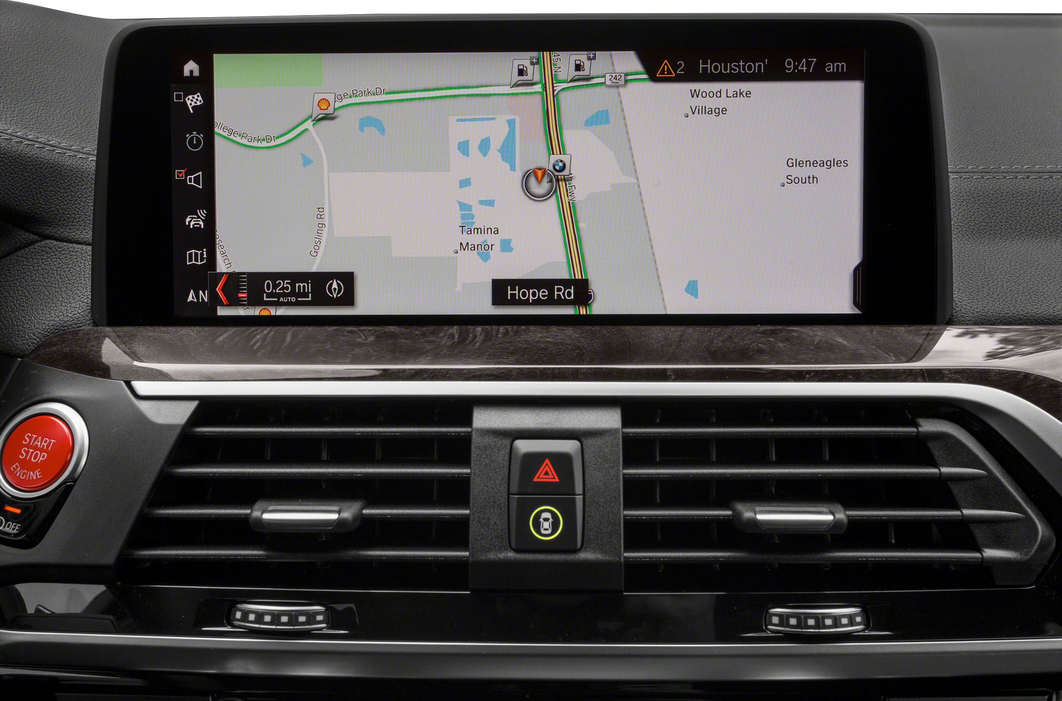 Navigation screen and central dashboard controls with air vents and engine start button