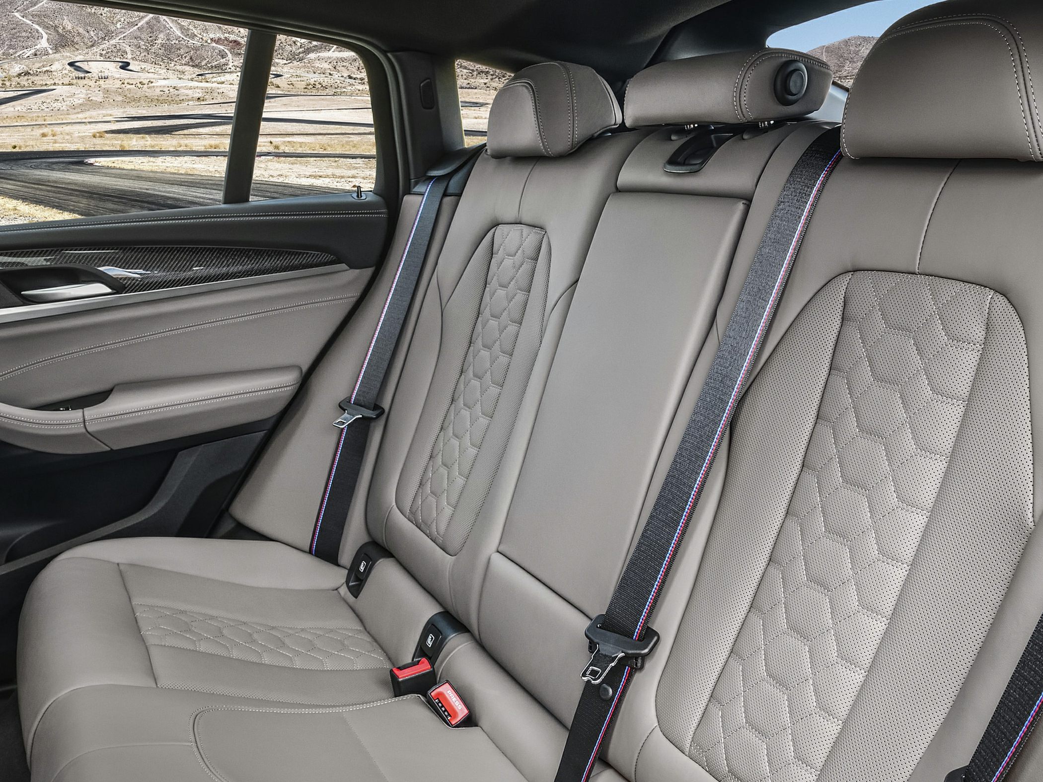 Quilted leather rear seats with sporty seat belts and premium stitching