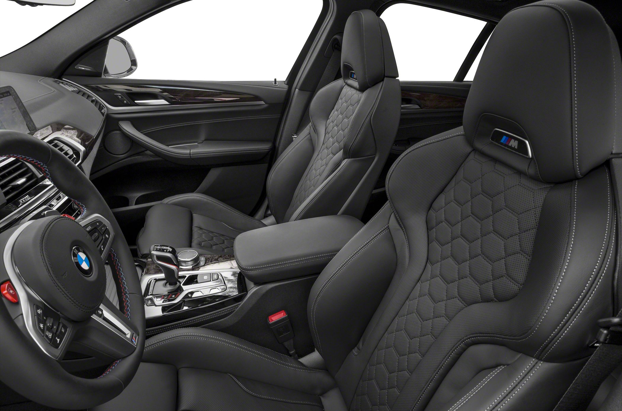 Luxurious black leather seats with hexagonal pattern and M badge.