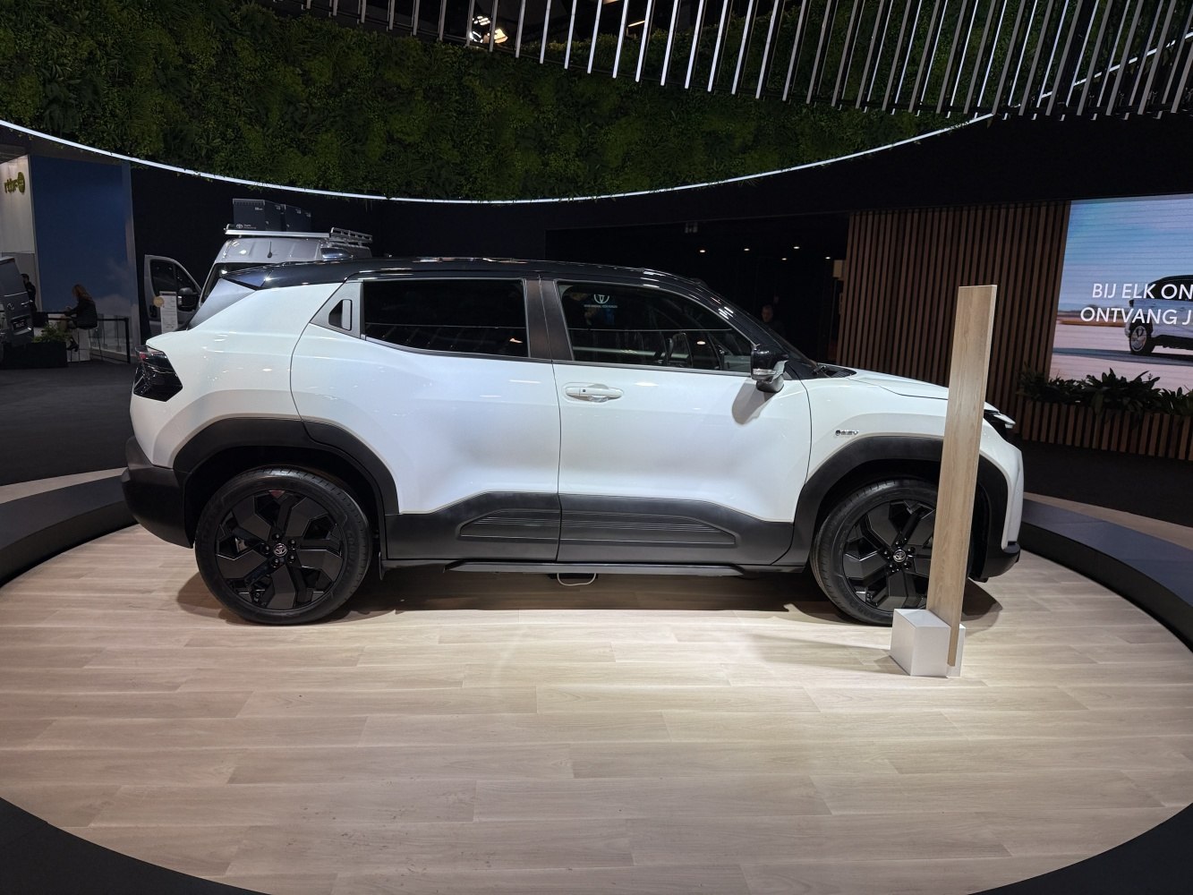 Side profile of an SUV with black alloy wheels